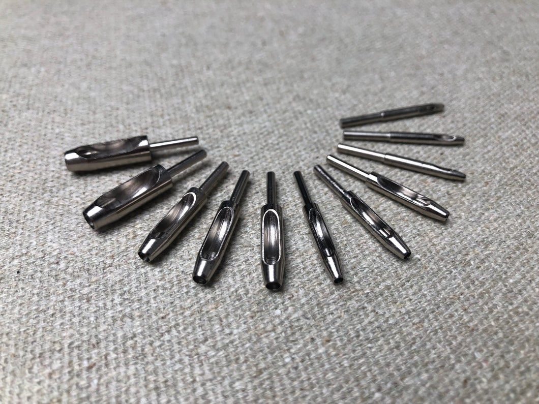 Hole punch needles with holder for brogueing